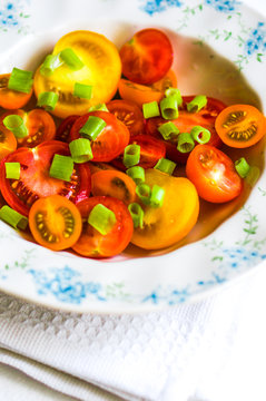 Colorful tomatoes with onion