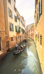 Fototapeta na wymiar Gondola with gondolier in Venice, Italy