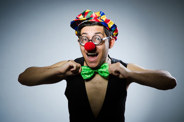 Funny clown against the dark background