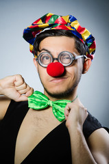 Funny clown against the dark background