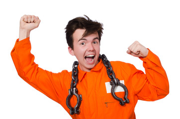 Young inmate with chains isolated on the white