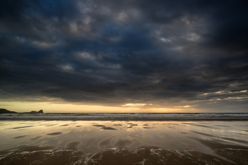 Dramatic stormy sky landscape reflected in low tide water on Rho © veneratio