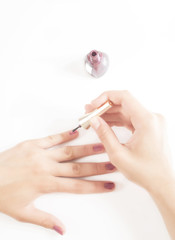 young girl herself makes a manicure