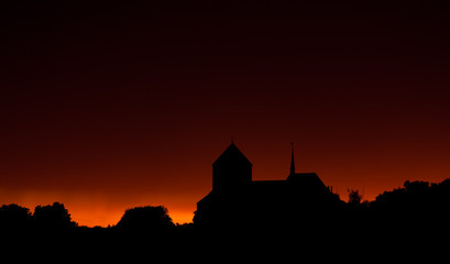 Obraz premium Sunset with church. church on a background of the sunset