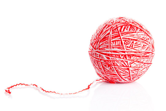 Red wool yarn ball isolated on white background