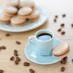 Cup of coffee with macaron