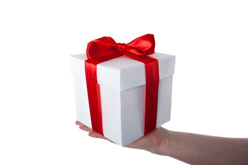 white gift box with red ribbon in hand