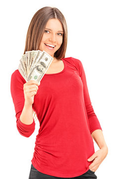 Beautiful young woman holding money