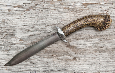 Old knife on the weathered wood