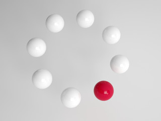 One different red ball in a circle
