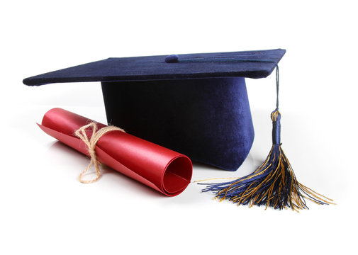 graduation hat and diploma isolated on white