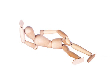 wooden dummy represents  lying having a rest person