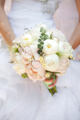 Bride with wedding bouquet, closeup