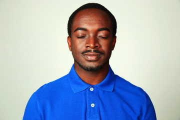 Fototapeta premium Portrait of a handsome african man isolated
