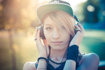 young beautiful model woman listening music