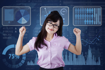 Strong businesswoman with business chart