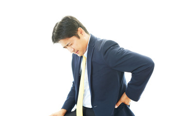 腰痛を訴えるビジネスマン