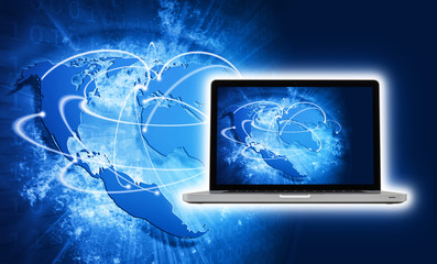 Blue vivid image of globe and laptop with screen