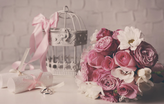 Beautiful wedding still life with bouquet on wall background