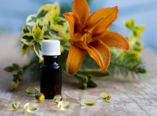 Massage oil with vitamin pills