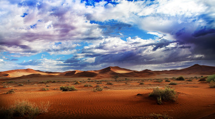 Desert dunes and clouds