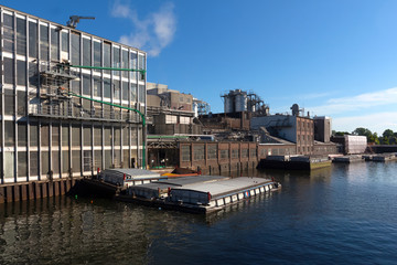 Factory  and noise from factory against sky on river