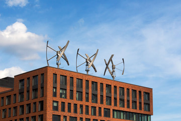 Wind turbines on the roof of a building - Powered by Adobe