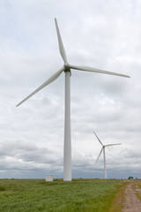 Fototapeta premium Pair of wind turbines on a wind farm.