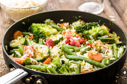 vegetable pan with fresh ingredients and rice