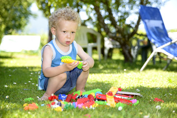 Baby playing on the lawn