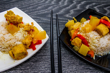 Chicken with pineapple and garnished with rice