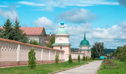 Fototapeta na wymiar Walls and towers of Monastery of Optina elders in Kozelsk