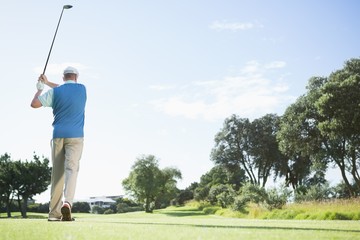 Golf player taking a shot