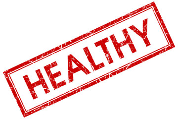 Healthy red square grungy stamp isolated on white background