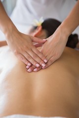 Obraz na płótnie Canvas Brunette enjoying a back massage