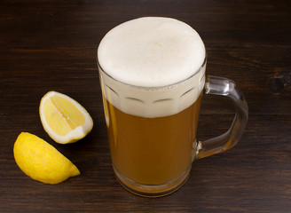 Glass of wheat beer and lemon