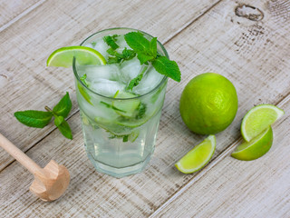 Mojito cocktail on wooden background