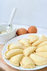 Making of varenyki or pierogy with cottage cheese (curd).