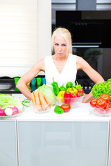 Happy woman cooks in the kitchen