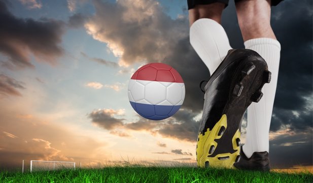 Composite image of football boot kicking dutch ball