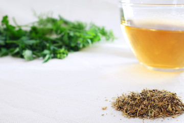 Herbal tea with green herbal leaf  and mixture of dried herbs