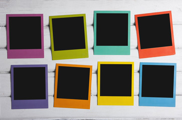 Color photo frames on planks