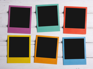 Color photos on wooden table