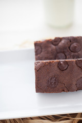 chocolate brownies dessert on the white plate and straw