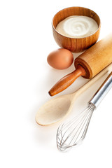 Ingredients and kitchen tools on white background.