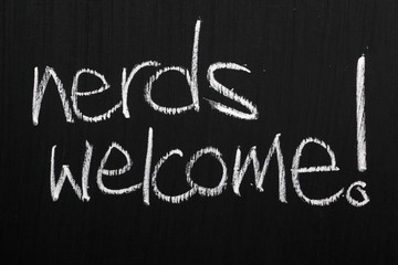 The phrase Nerds Welcome on a blackboard