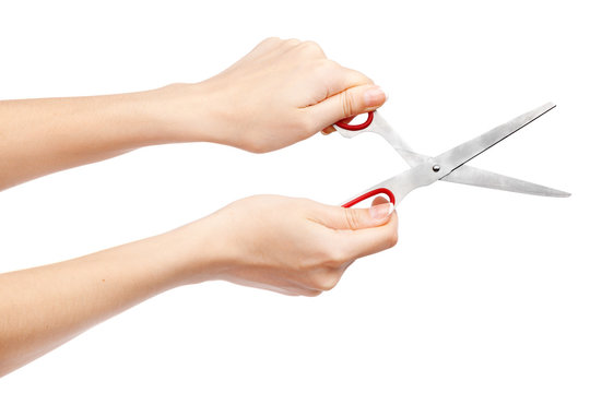 Female hand holding scissors
