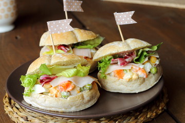 Russian salad sandwiches in a party table