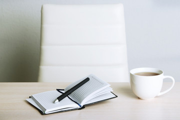 Empty workplace in office on gray background