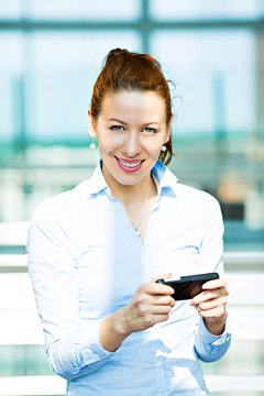 Business woman sending text message on phone